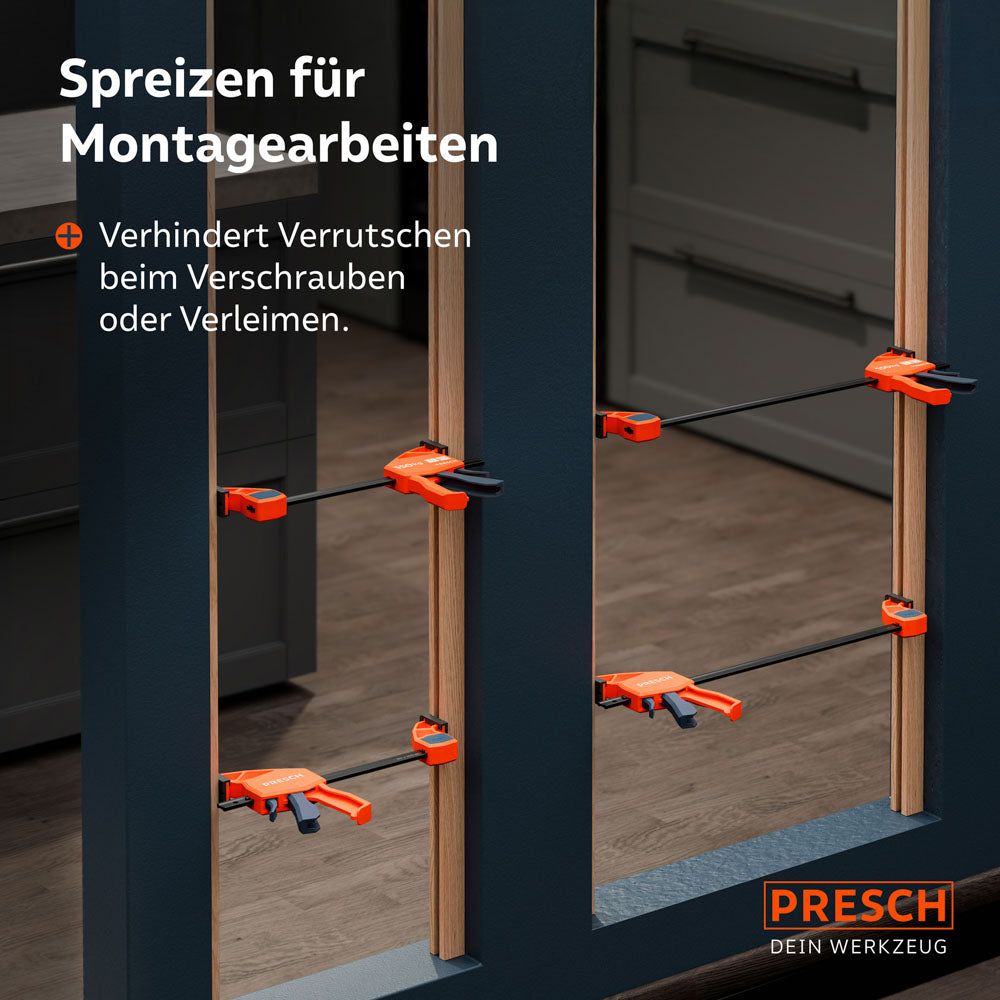 Anwendung im Innenausbau: Mehrere Einhandzwingen werden im Spreizmodus genutzt, um Holzrahmen in einer Nische während des Verschraubens exakt zu fixieren und gegen Verrutschen zu sichern.