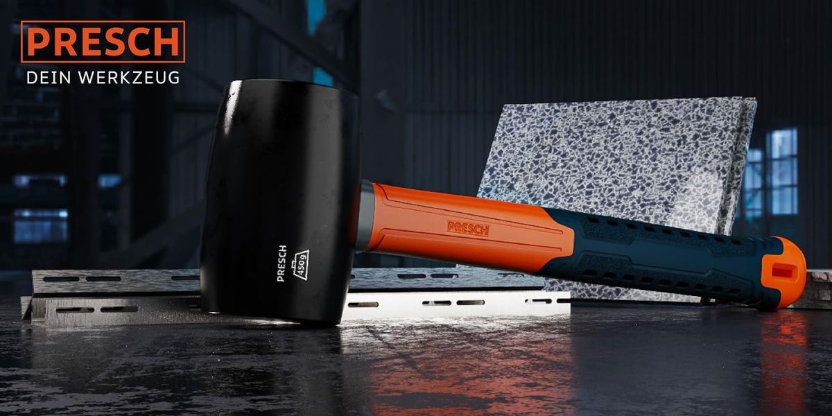 PRESCH Gummihammer in Schwarz mit robustem orangen Griff auf Arbeitsfläche