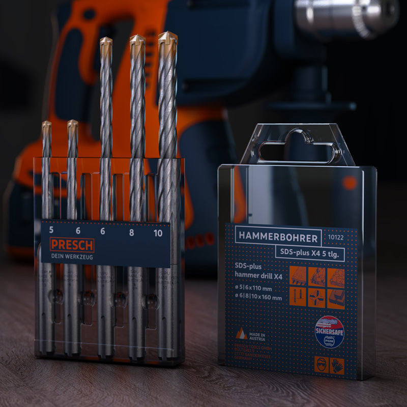 PRESCH SDS-Hammerbohrer X4 5-teiliges Set in Verpackung mit Bohrmaschine im Hintergrund.