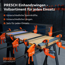 Die PRESCH Einhandzwingen-Familie im professionellen Einsatz: Gezeigt werden verschiedene Modelle von 75kg bis 300kg Spannkraft, die gemeinsam eine massive Holzplatte auf Arbeitsböcken für die Verleimung fixieren.
