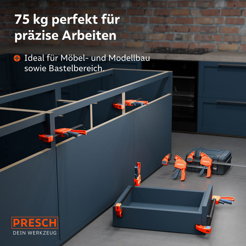 Anwendungsbeispiel im Möbelbau: Mehrere Einhandzwingen aus dem Set fixieren Korpus-Teile und eine Schublade während der Montage in einer Küche.
