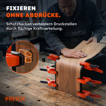 Beschermende ruggen van de veer klemmen voorkomen drukplekken op een fineerd houten werkstuk.