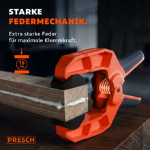 Federzwinge presst mit starker Federmechanik zwei verleimte Holzteile mit 15 kg Kraft zusammen.