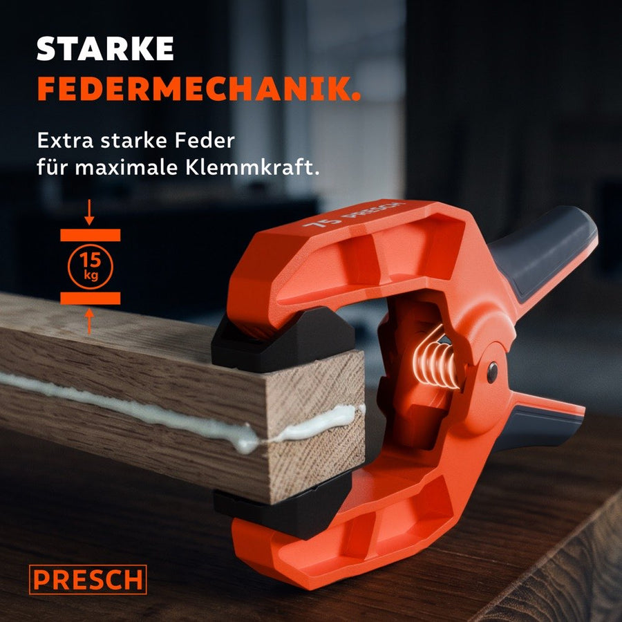 Federzwinge presst mit starker Federmechanik zwei verleimte Holzteile mit 15 kg Kraft zusammen.
