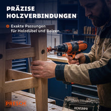 Handwerker bohrt mit einem Forstnerbohrer ein Loch für einen Holzdübel in ein Stuhlbein.