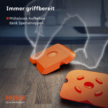 Vue détaillée des lisseurs de joint oranges sur une surface en bois ; des protubérances spéciales intégrées permettent de soulever aisément les outils du sol plat.