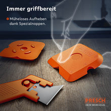 Detailweergave van de gereedschappen op een houten oppervlak; speciale noppen op de gladde oppervlakken vergemakkelijken het oppakken van gladde oppervlakken tijdens het werk.
