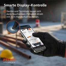 Touchscreen-functie: Een smartphone wordt op een bouwplaats direct bediend met de zwarte Heavy Duty nitrilhandschoenen.