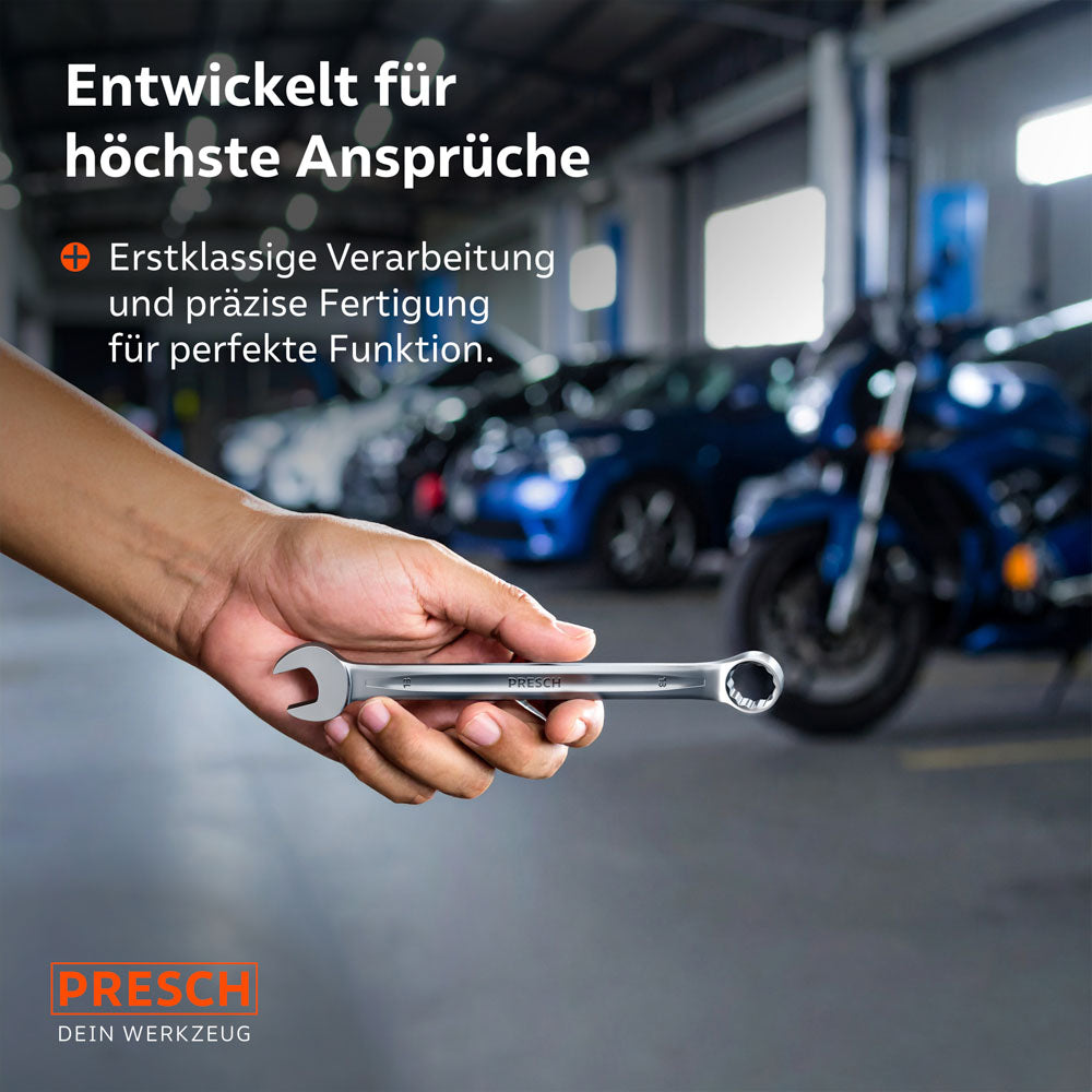 Une main présente la clé à anneau élancée dans un atelier automobile. La fabrication précise est conçue pour des applications professionnelles dans la construction automobile et l'industrie.