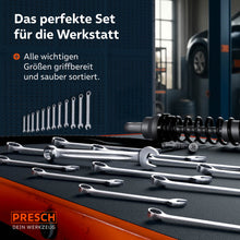 Une sélection des 21 clés à anneau est à portée de main sur un chariot d'atelier. En arrière‑plan, la sacoche à roulettes est fixée à un mur d'outils, à côté se trouvent un véhicule et du matériel d'atelier.