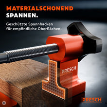 Spannbacke mit geriffelter Schutzauflage drückt schonend gegen die Kante eines Holzbretts