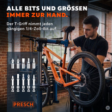 Monteur monteert met de T-greep bithouder aan een mountainbike in de werkplaats