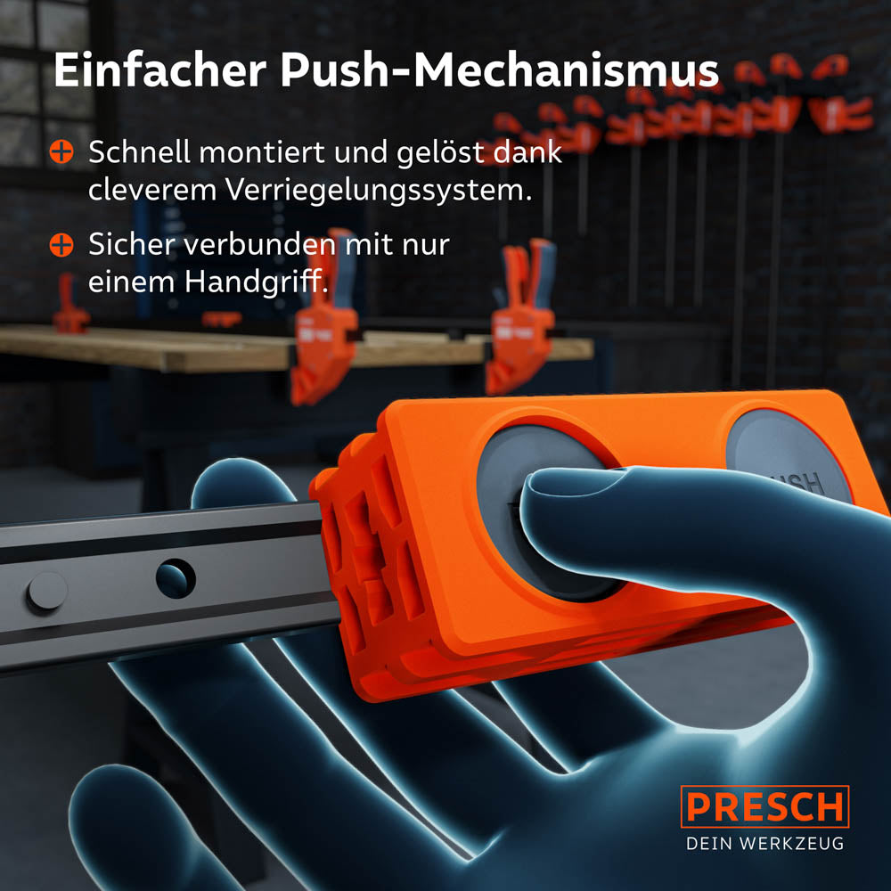 Detailansicht der Handhabung: Ein Daumen drückt auf die Verriegelungstaste, um die Zwingenschiene sicher im Adapter zu fixieren oder schnell wieder zu lösen.