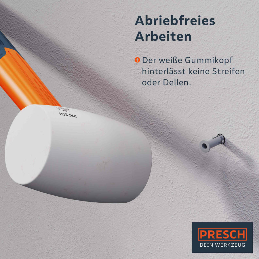 PRESCH Gummihammer Modell 10154 für abriebfreie Arbeiten, Schonhammer mit weißem Kopf an einer Wand, ohne Beschädigungen zu hinterlassen.